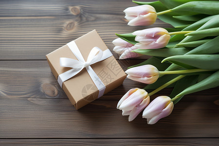 木板上的礼盒和鲜花背景图片