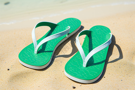 海滩上的绿色拖鞋背景图片