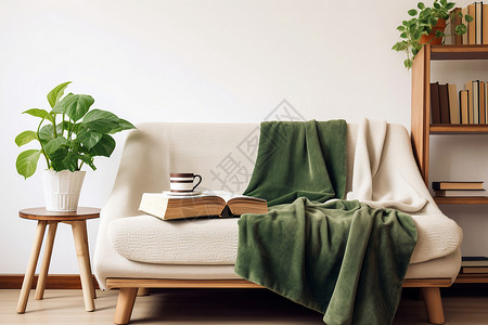 白色沙发上的绿色毯子背景图片