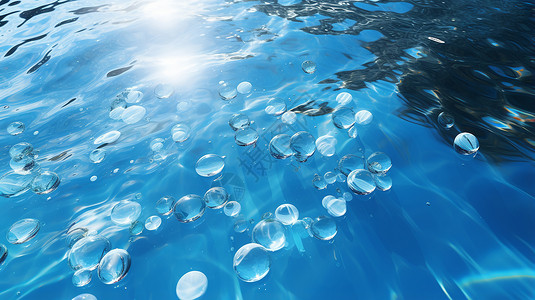 蓝色清澈海水阳光下海面上的气泡设计图片