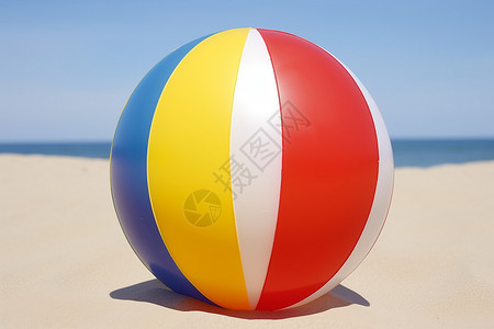 夏日沙滩上的塑料排球背景图片