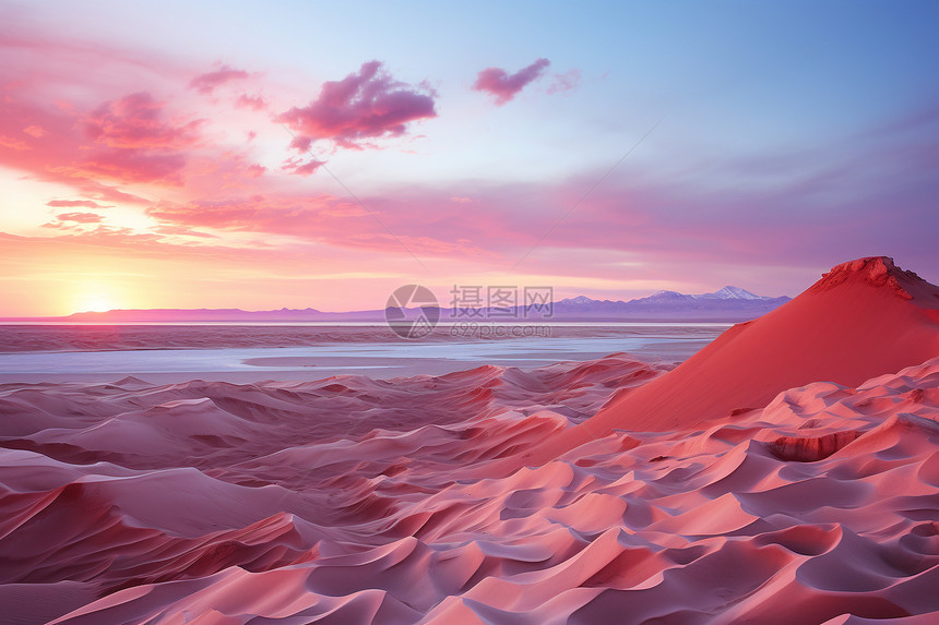 夕阳下的粉色调色沙漠图片