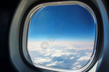 飞机窗外的天空背景图片
