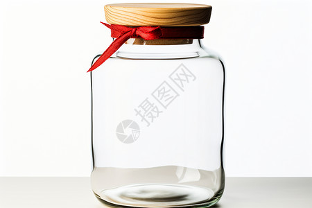 红色丝带包裹的玻璃罐高清图片
