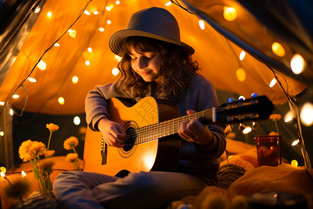 夜晚帐篷中演奏吉他的女孩背景图片