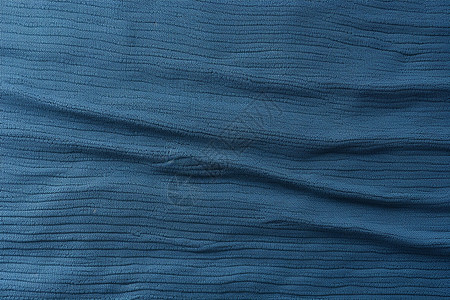 蓝色织物上的纹理细节背景图片