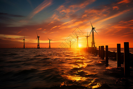 日落中的发电风车背景图片