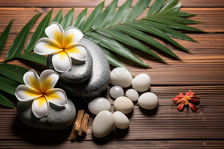芳香疗法的鹅卵石和鲜花背景图片