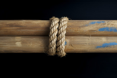 木柱上缠绕的麻绳背景图片