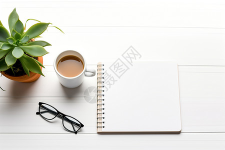 办公的本子和咖啡背景图片