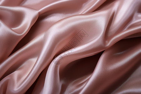 粉色的绸缎褶皱背景图片
