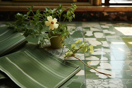 绿色布料地板上的布料和花瓶背景