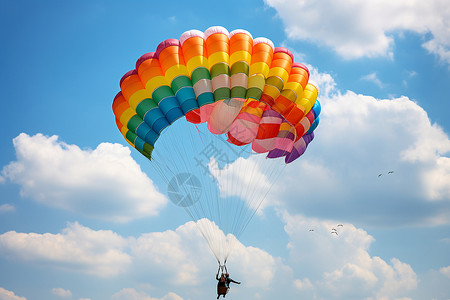 悬挂滑翔运动天空中的伞兵背景