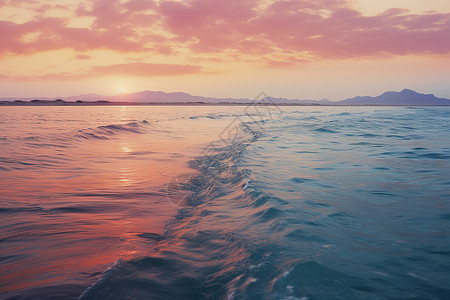 日落下的海洋海浪背景图片