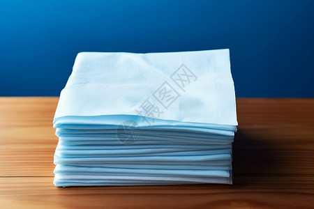 折叠的白色餐巾纸背景图片