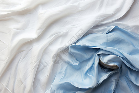 凌乱褶皱的丝绸织物布料背景图片
