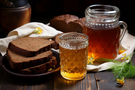 木桌上的啤酒和面包背景图片