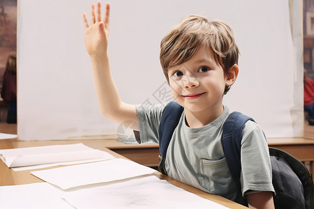 课堂上举手回答问题的小男孩背景图片