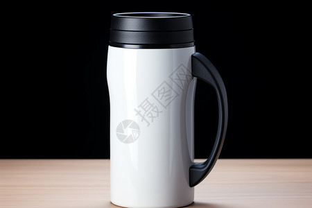黑手柄的白色咖啡杯背景图片
