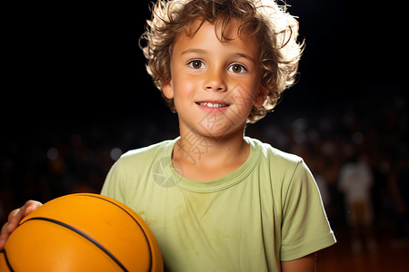 小男孩拿着篮球背景图片