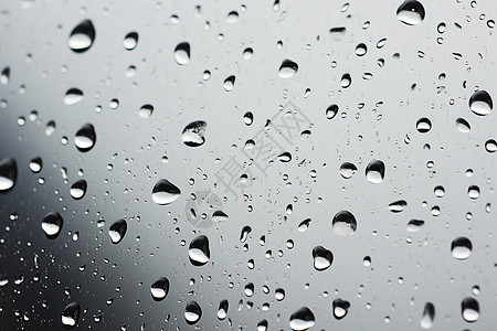雨中微观水珠沾湿的窗户玻璃背景图片