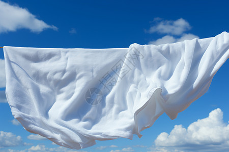 白色床单在晾衣绳上背景图片