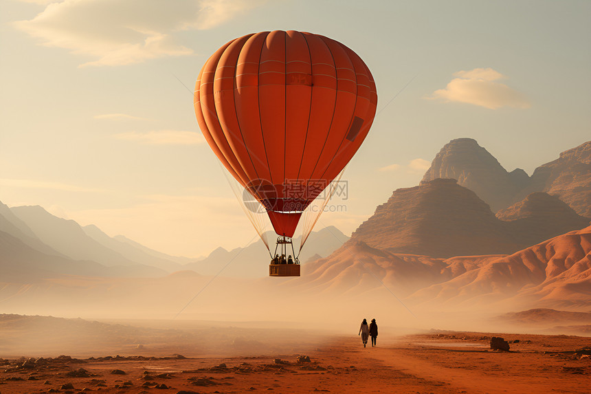 翱翔沙漠中的热气球图片