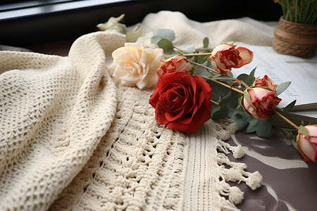 窗台上的花毯和玫瑰花背景图片