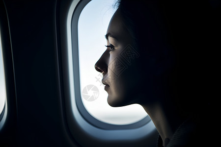 飞机窗户前的女性背景图片
