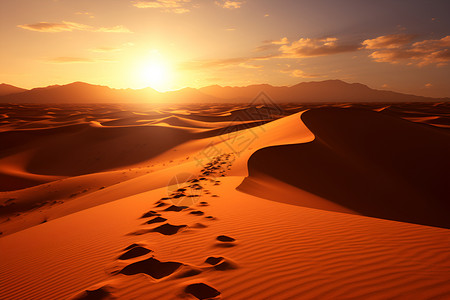 黄昏沙漠沙漠里的脚印背景