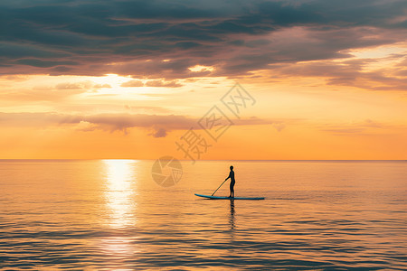 划桨板夕阳下冲浪者背景