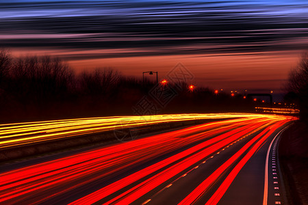 模糊公路高速行驶的道路灯光设计图片