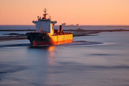 海上日出巨型货船背景图片