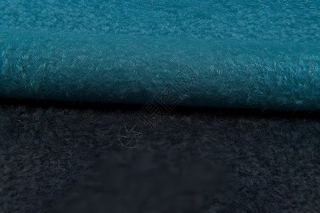 蓝黑渐变橡胶地毯背景