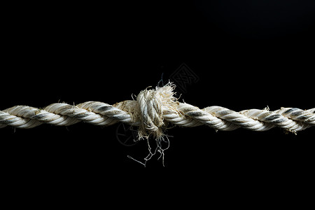 绳子断裂一根带结的绳子背景