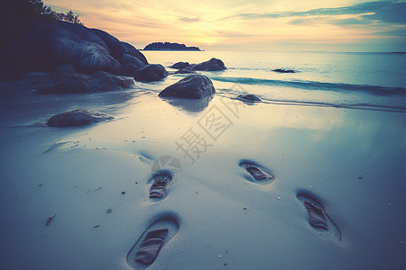 海滩上的脚印背景图片