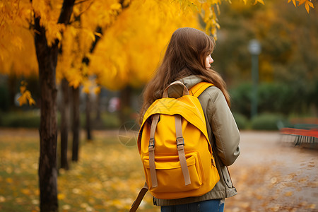 黄色学生背包黄色背包的女子背景