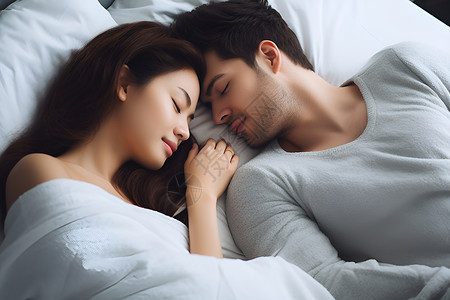 一张床上睡觉的夫妻背景图片