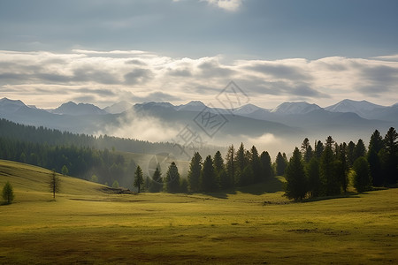 田野远处的山脉和白云背景图片