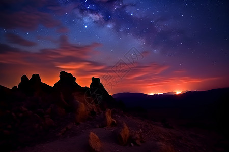 夜晚星空下的神秘山脉背景图片