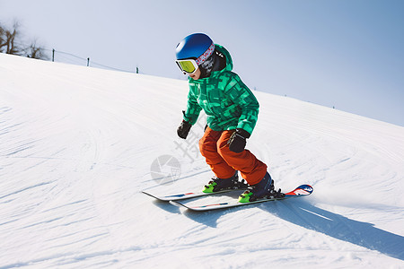 冬季雪山中滑雪的小男孩背景图片
