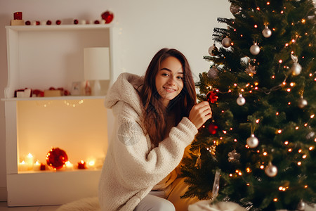 圣诞女孩与点燃的圣诞树背景图片