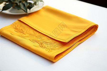 手工刺绣工艺的黄色餐布背景图片
