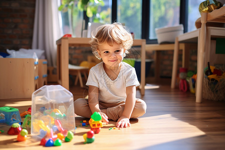 幼儿园玩积木的小男孩背景图片
