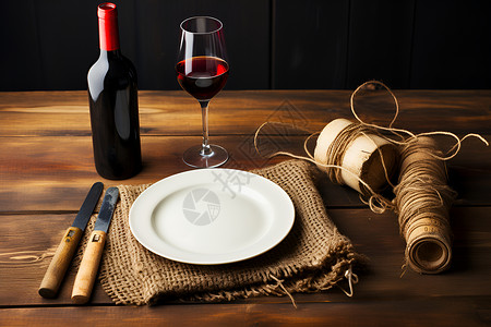 餐桌上的红酒和餐具背景图片