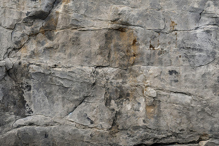 宽阔的岩壁风化的岩石峭壁背景
