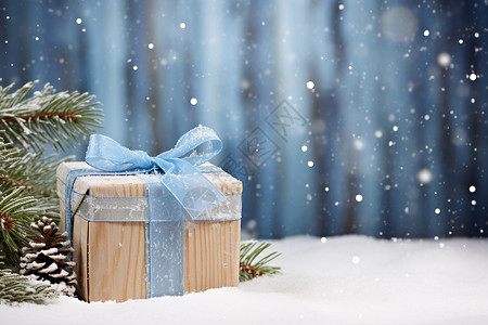 冬日里蓝丝带下的礼盒背景图片