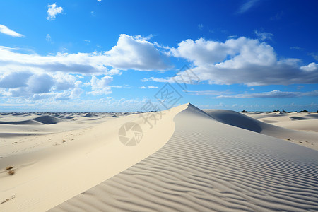 沙丘与白云背景图片