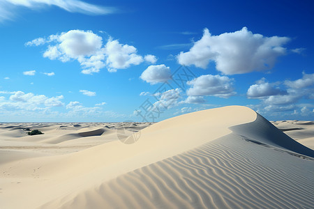 白云下的沙丘背景图片