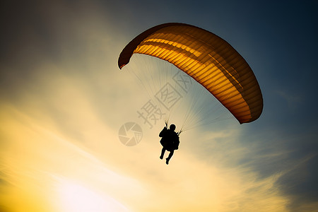 天空中降落伞上的男人背景图片